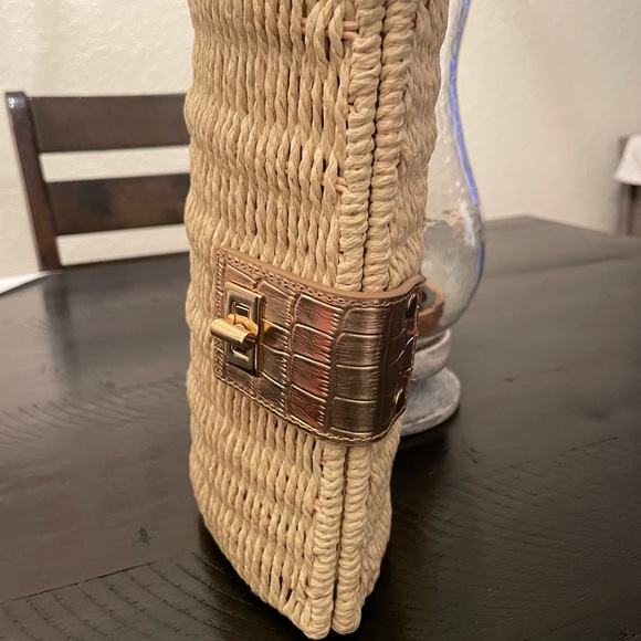Ann Taylor straw woven clutch with gold accents. Fold over toggle closure. - Picture 2 of 12
